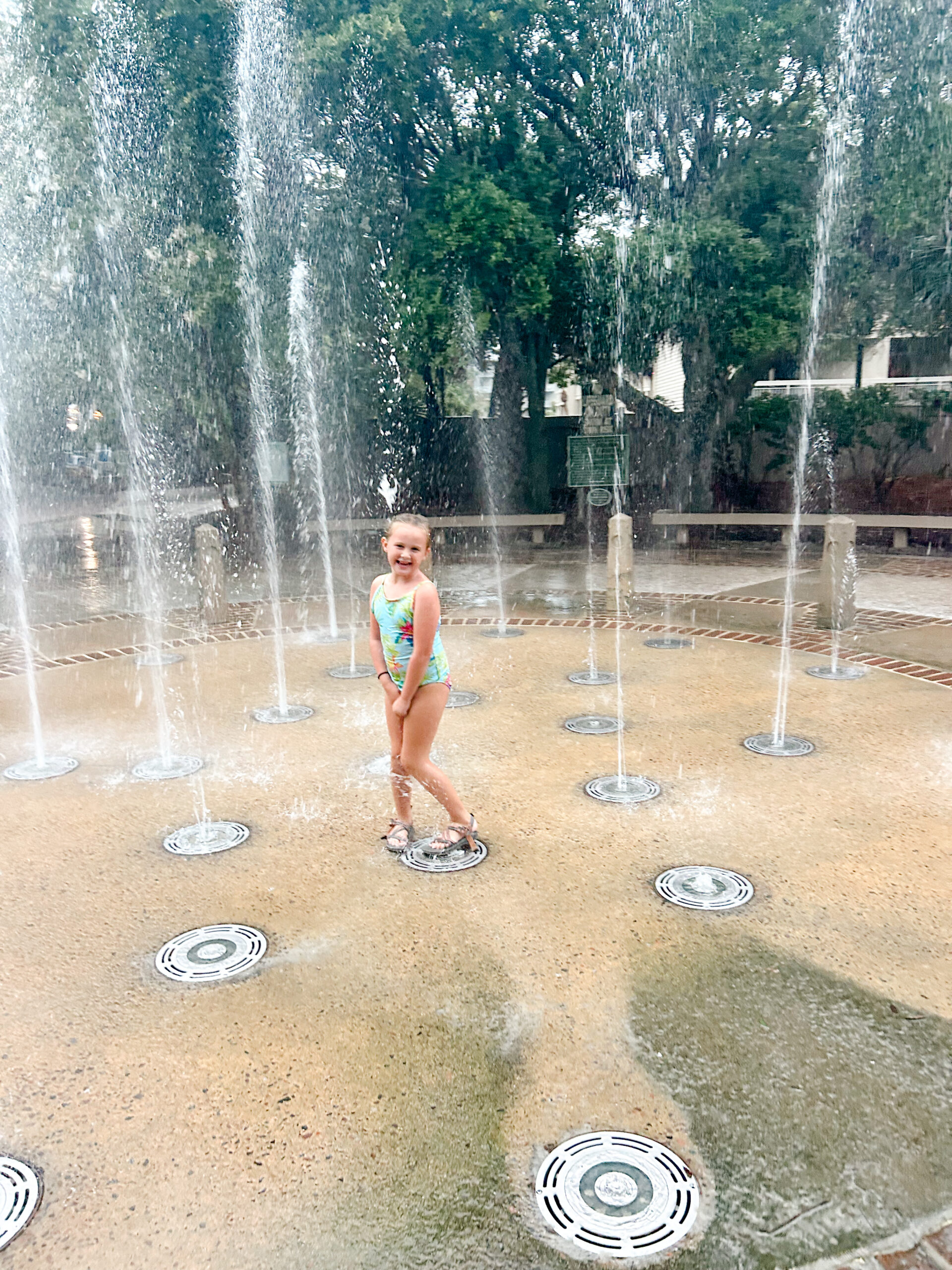 Child playing in splash pad at Coligny Beach